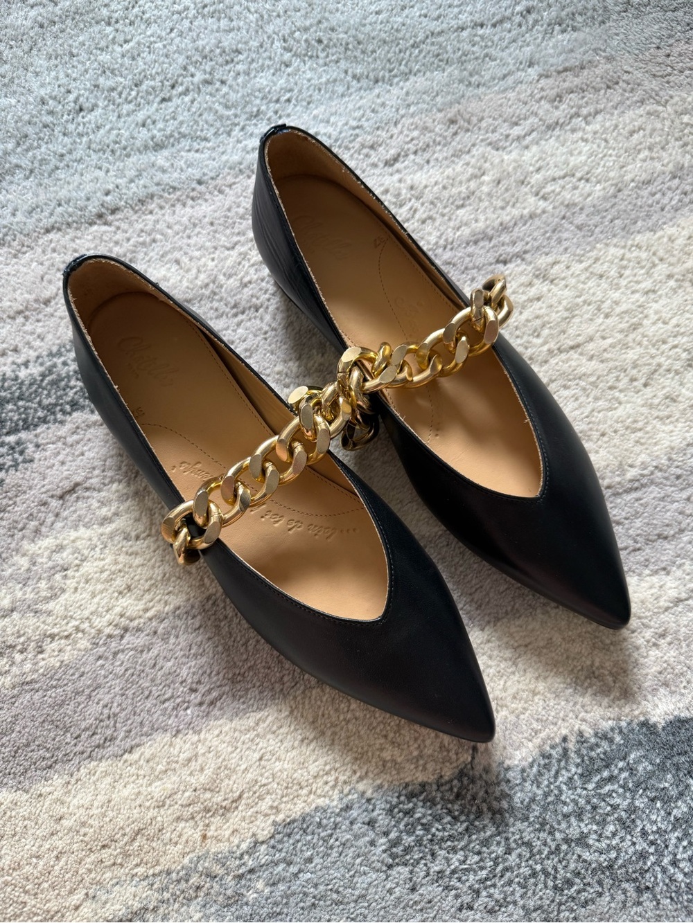 Chatelles Black Pointed Toe Flats with Gold Chain Accent